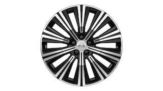 Volvo alloy wheel with a multi-spoke black and silver design, featuring the Volvo logo at the center.