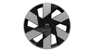 Volvo alloy wheel with a modern, geometric spoke design in dark and light finishes.