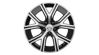 Obręcz kół ze stopu lekkiego Volvo o nowoczesnym, geometrycznym wzorze wieloramiennym i logo Volvo pośrodku.