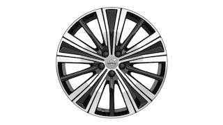 Volvo alloy wheel with a multi-spoke black and silver design and Volvo logo at the center.