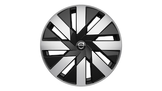 Zbliżenie na felgę aluminiową Volvo z nowoczesnym, geometrycznym wzorem szprych.