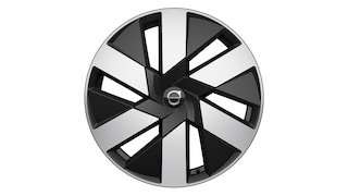 Lichtmetalen velg van Volvo met een modern, geometrisch zwart en zilverkleurig design met het Volvo-logo in het midden.