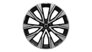 عجلة من المزيج المعدني من فولفو بتصميم هندسي متعدد الأضلاع باللونين الأسود والفضي.