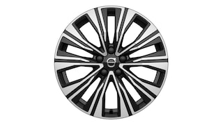 Wieloramienna czarno-srebrna obręcz kół Volvo z logo Volvo na środku.