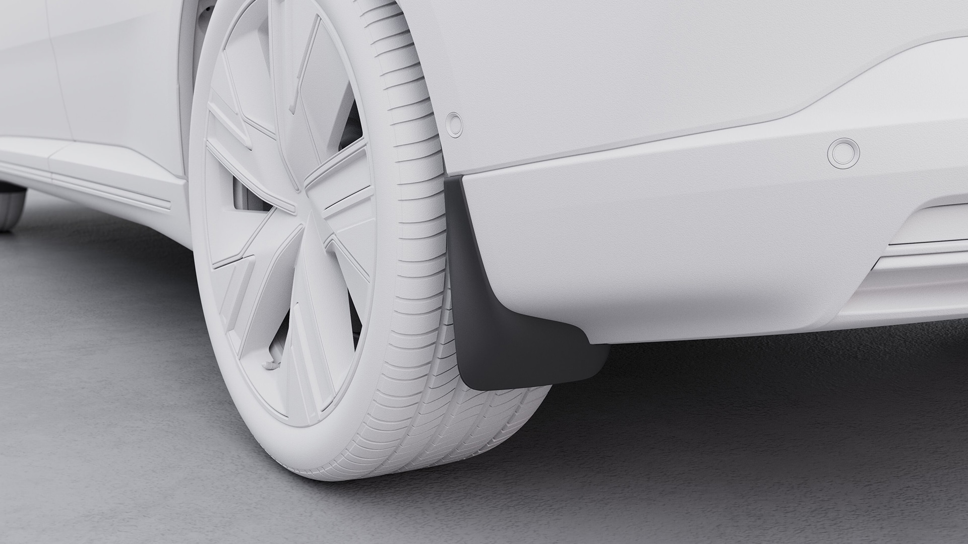 Primo piano della ruota posteriore e del paraspruzzi di un veicolo Volvo, che evidenzia l'accessorio paraspruzzi.