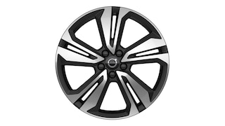 Volvo alloy wheel with a modern five-spoke design in a black and silver finish.